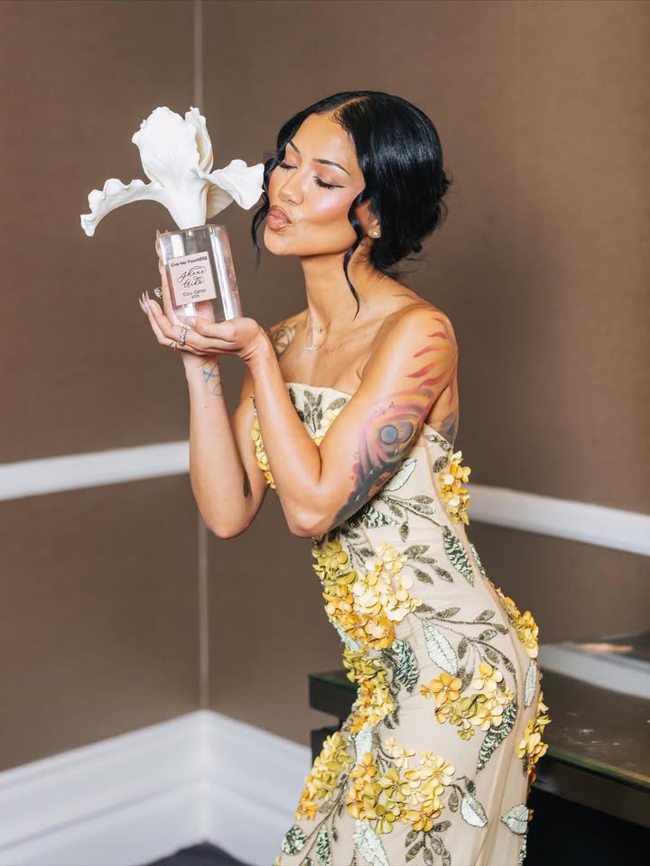 May be an image of one or more people, makeup, dress, gown and text