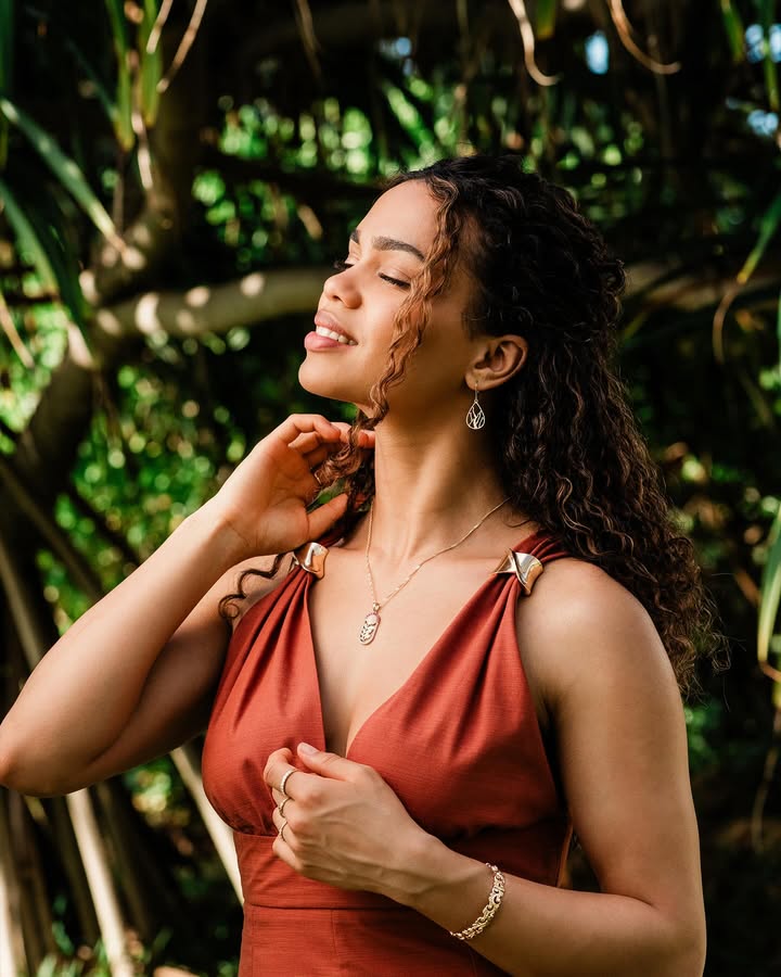 May be an image of one or more people, makeup, sundress, outdoors and text