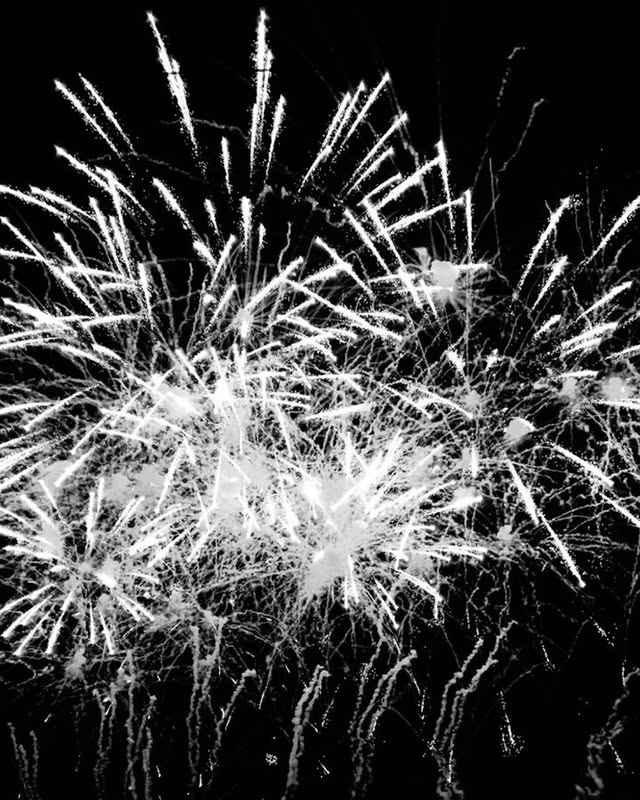 May be a black-and-white image of sparkler, fireworks and text