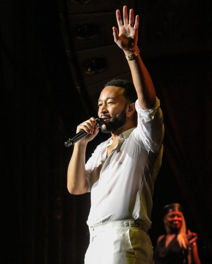 May be an image of microphone, tambourine, concert and text