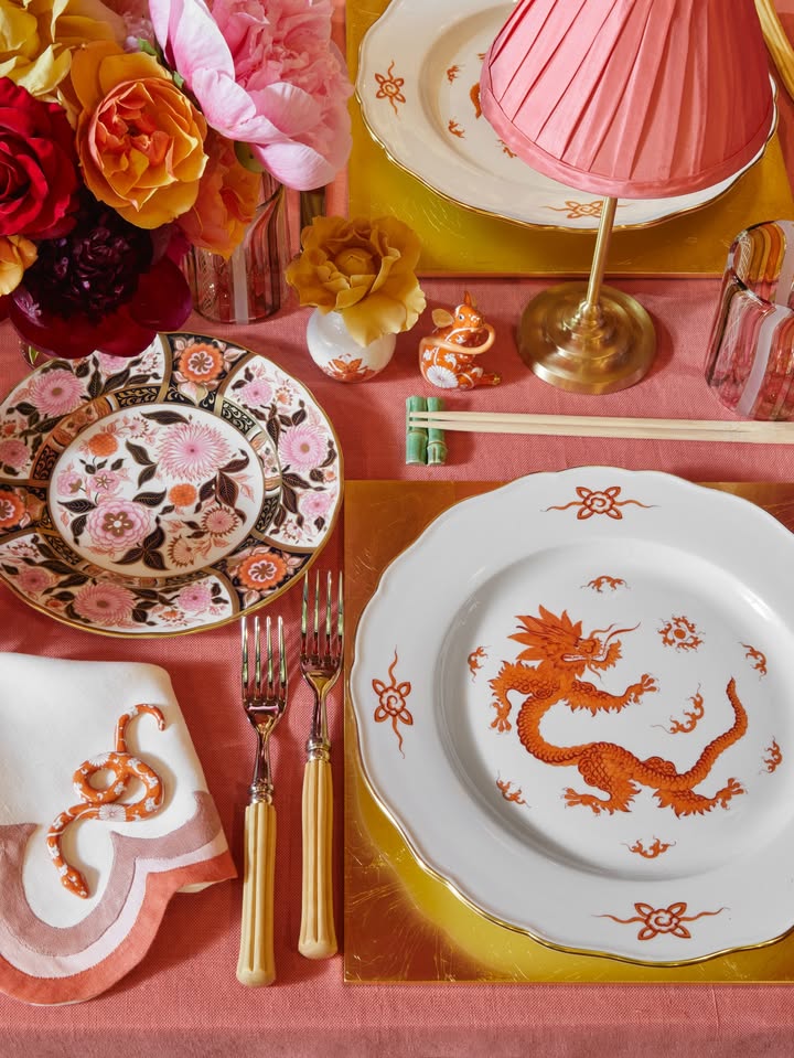 May be an image of napkin ring, placemat, chinaware, napkin, chopsticks, tablecloth and text