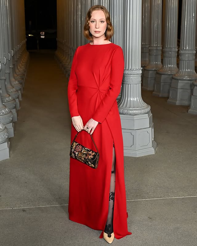 May be an image of gown, dress and text