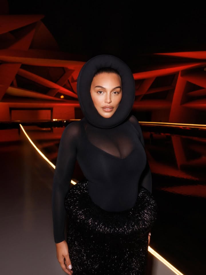 May be an image of one or more people, makeup, gown, turtleneck and text