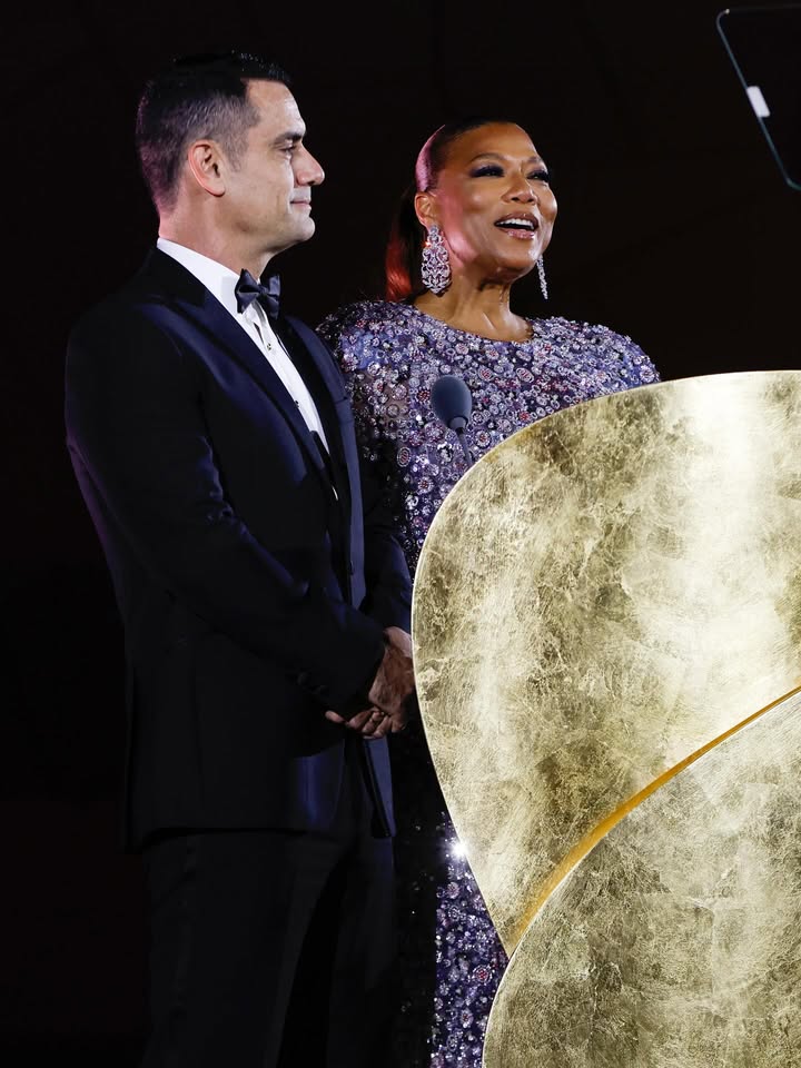 May be an image of one or more people, dress, dinner jacket, gown and text