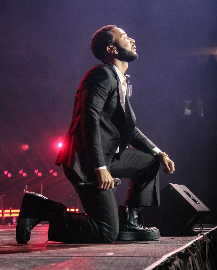 May be an image of blazer, concert and text