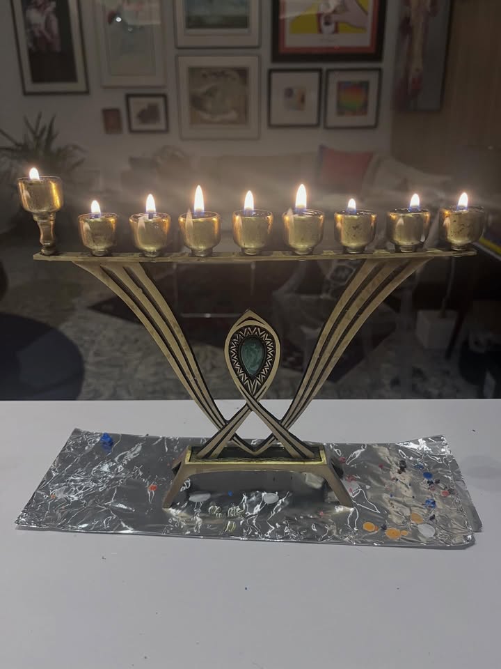 May be an image of candle holder, candle and text