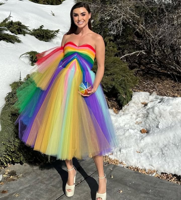 May be an image of dress and text