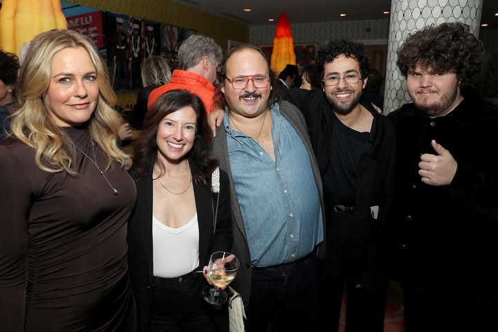 May be an image of one or more people and text