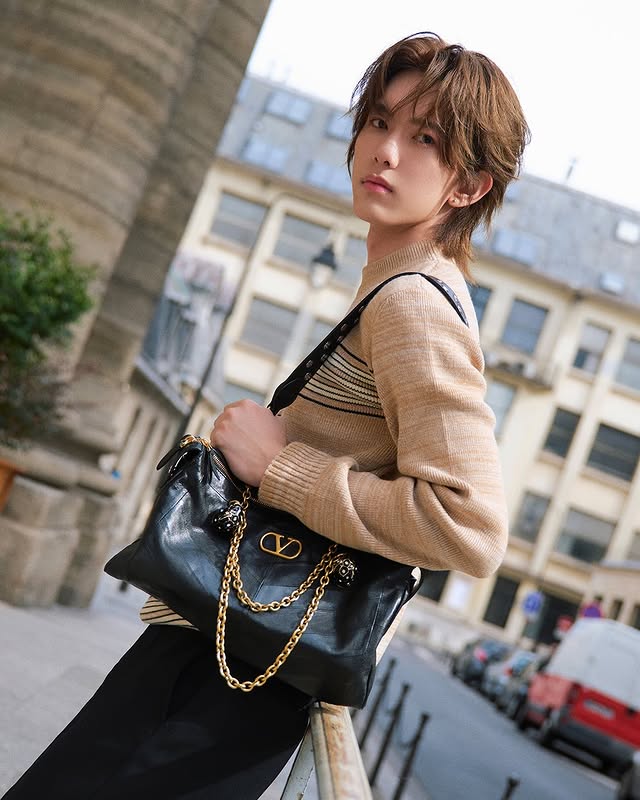 May be an image of one or more people, makeup, hair, purse and text