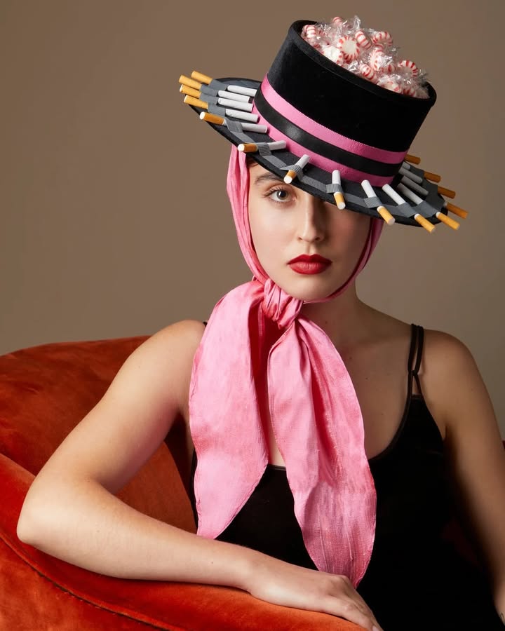 May be an image of hat, headscarf and text