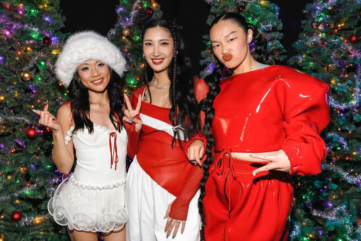 May be an image of one or more people, people dancing, christmas tree, tinsel, costume and text