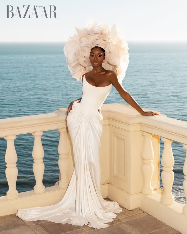 May be an image of headdress, gown, headscarf and text