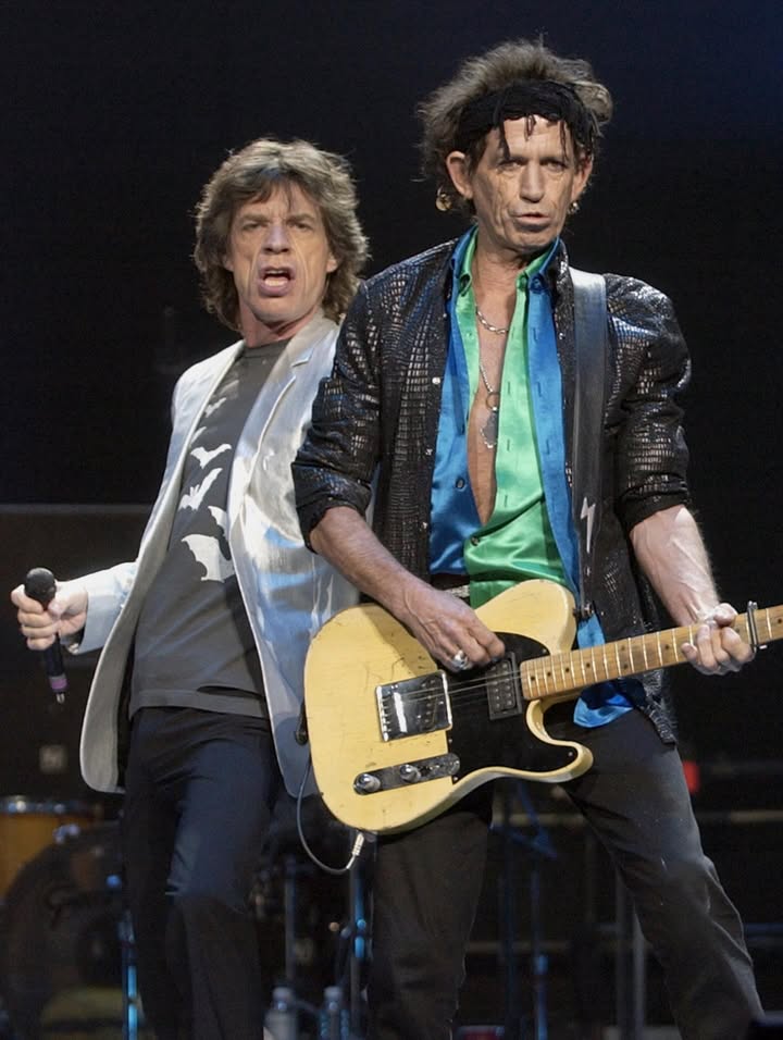 May be an image of guitar, concert and text