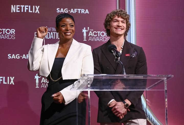 May be an image of standing and text