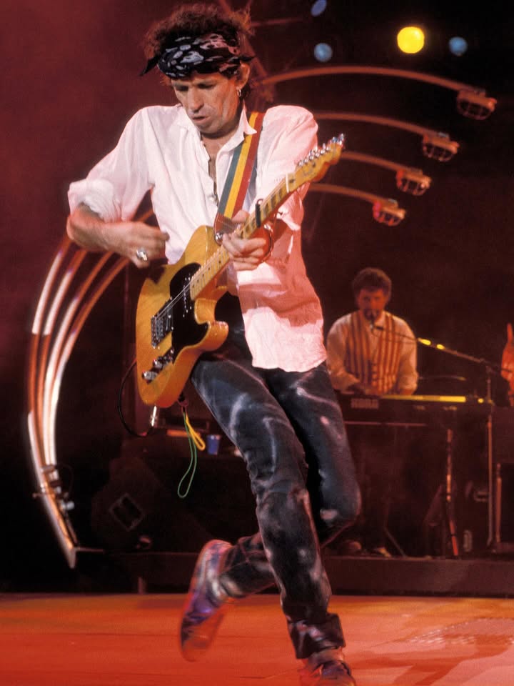 May be an image of guitar and text