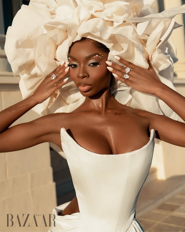 May be an image of one or more people, makeup, headdress, gown and text