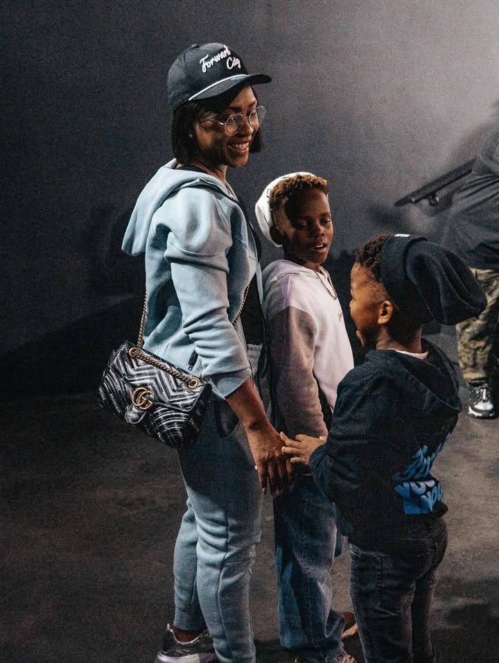 May be an image of child, standing and text