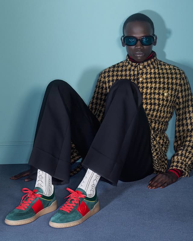May be an image of eyewear, wingtip shoes, turtleneck and text