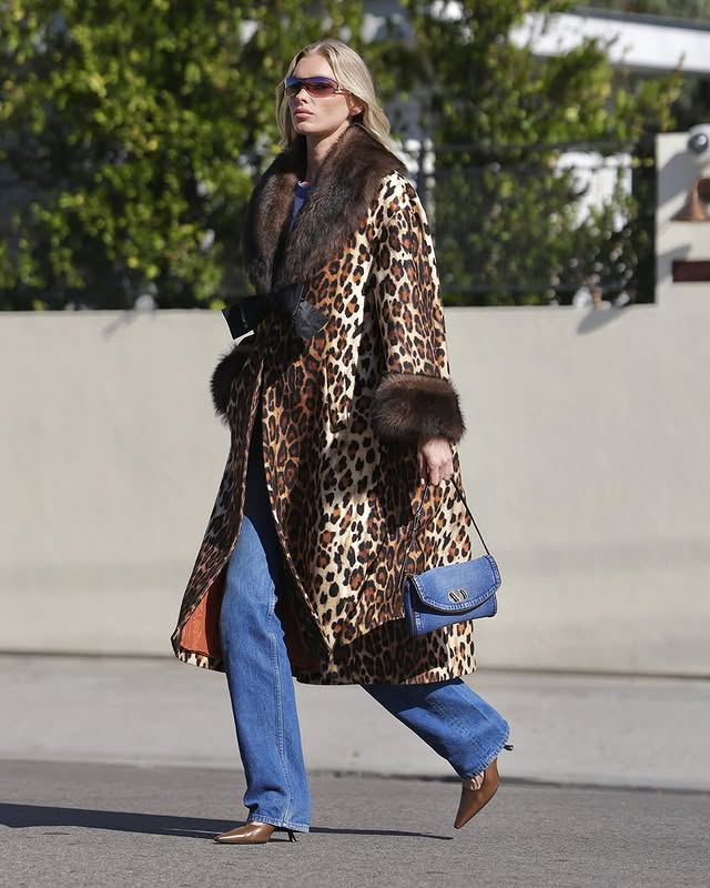 May be an image of fur coat and text