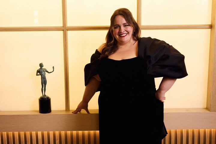 May be an image of one or more people, gown and text