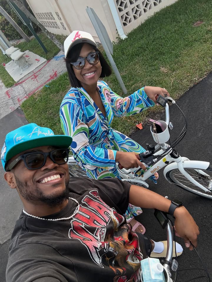 May be an image of smiling, bicycle and text