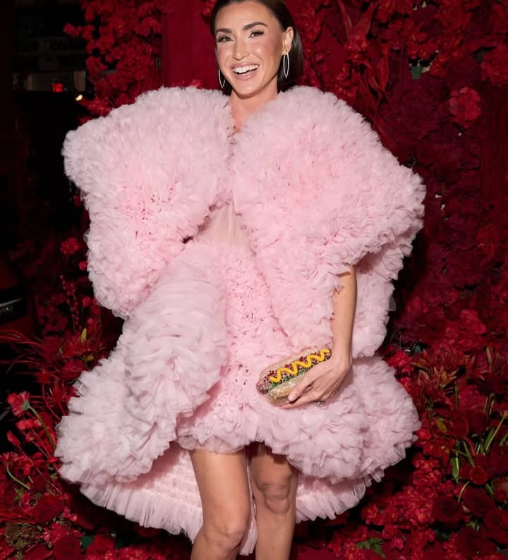 May be an image of one or more people, makeup, fur, dress and text