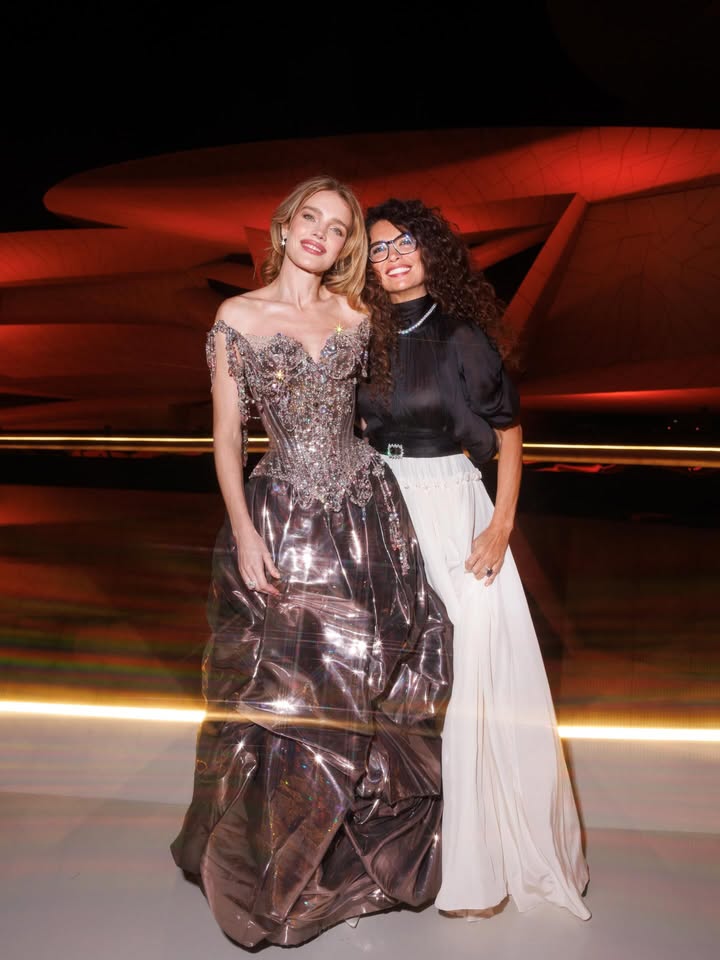 May be an image of gown, dress and text