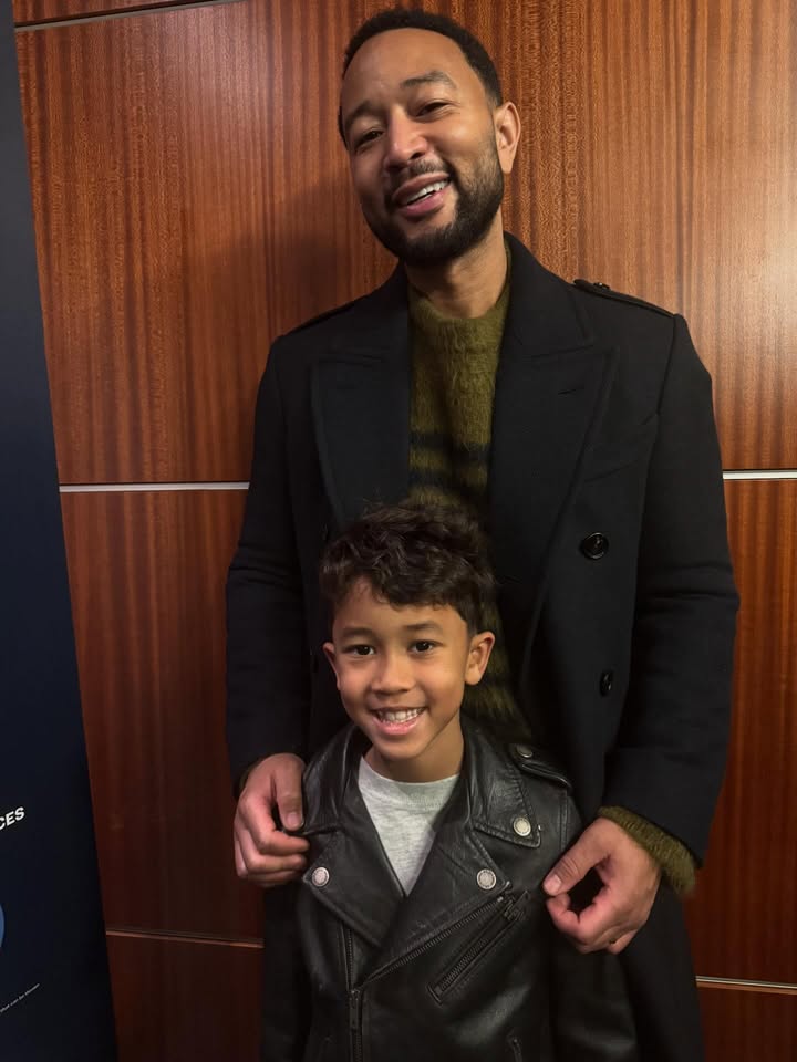 May be an image of child, standing, blazer and text