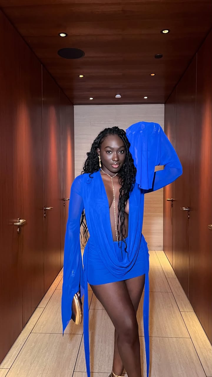 May be an image of one or more people, dress and text