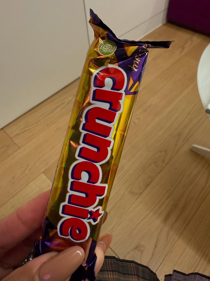 May be an image of chocolate bar, wafer and text