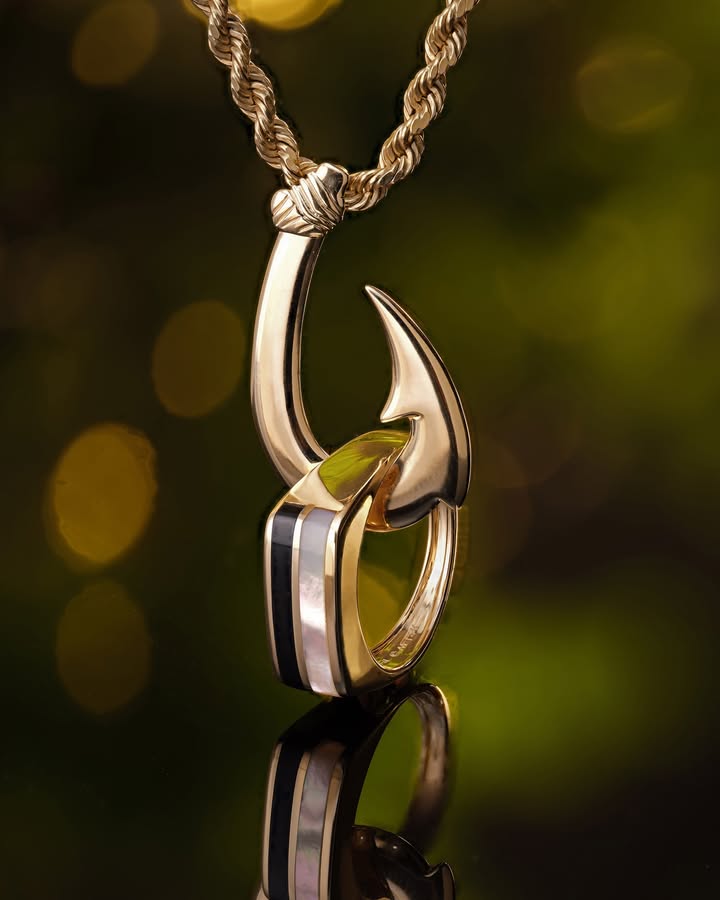 May be an image of jewelry, fish hook and text