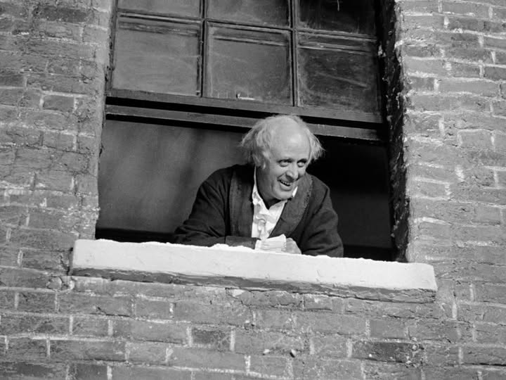 May be a black-and-white image of brick wall, window and text