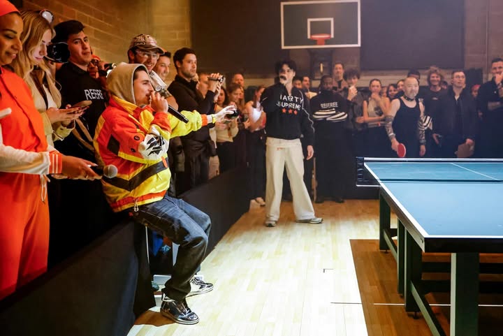 May be an image of billiards, ball, racket, crowd and text