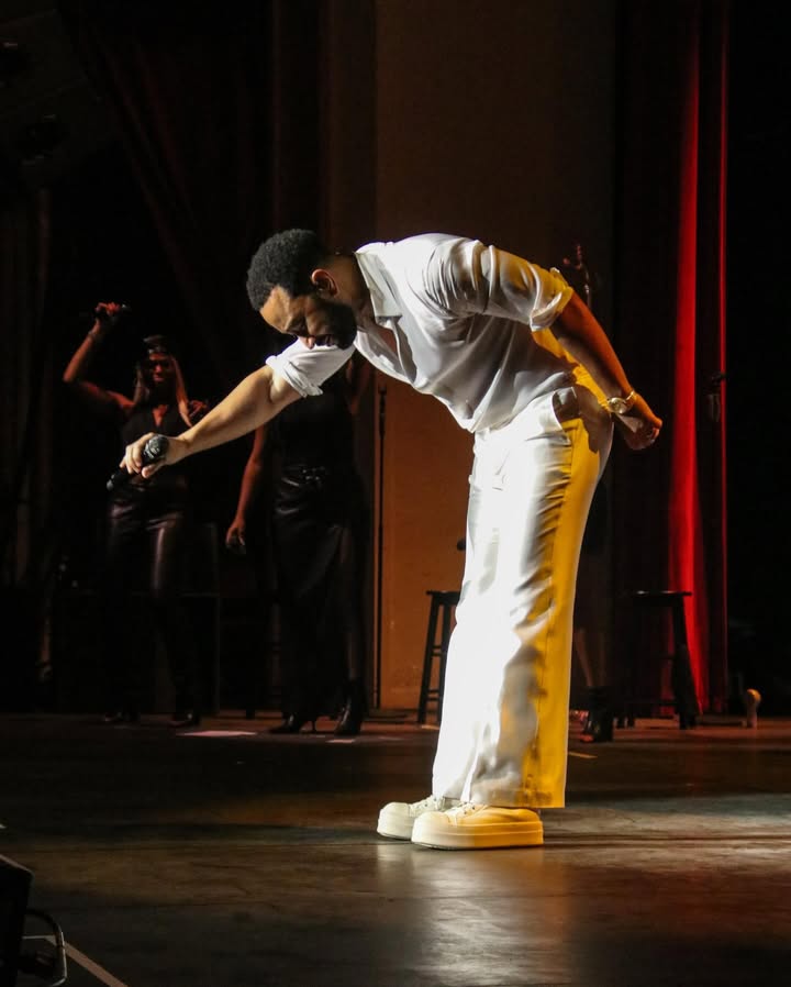 May be an image of dancing, microphone, concert and text