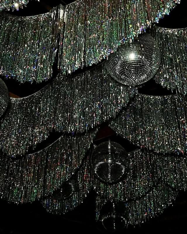 May be an image of chandelier and text