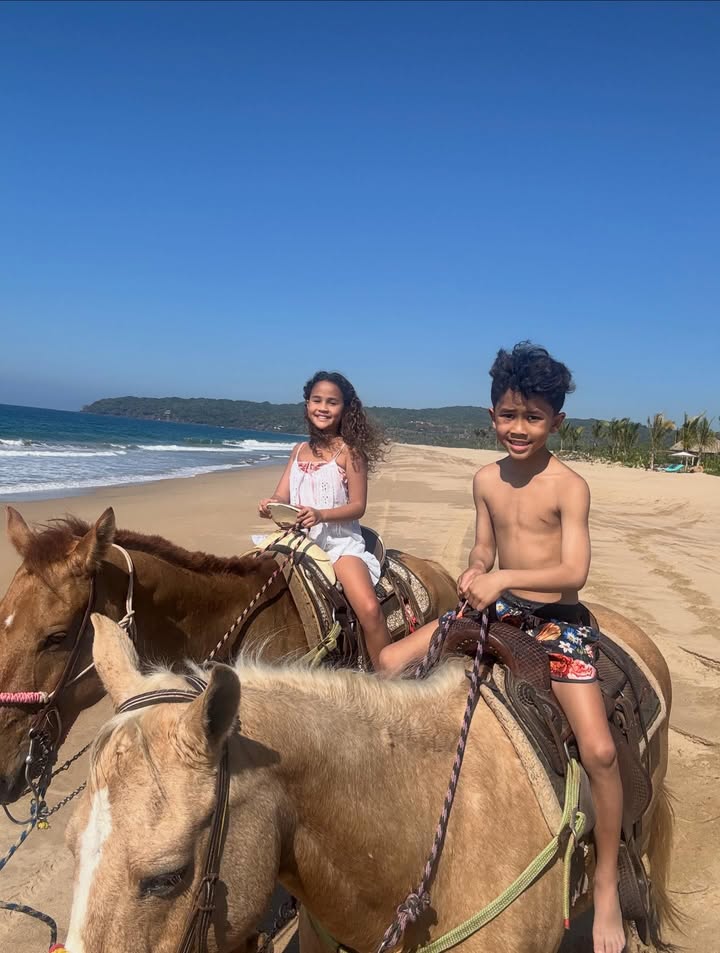 May be an image of riding on a horse, horse, pony, beach and text