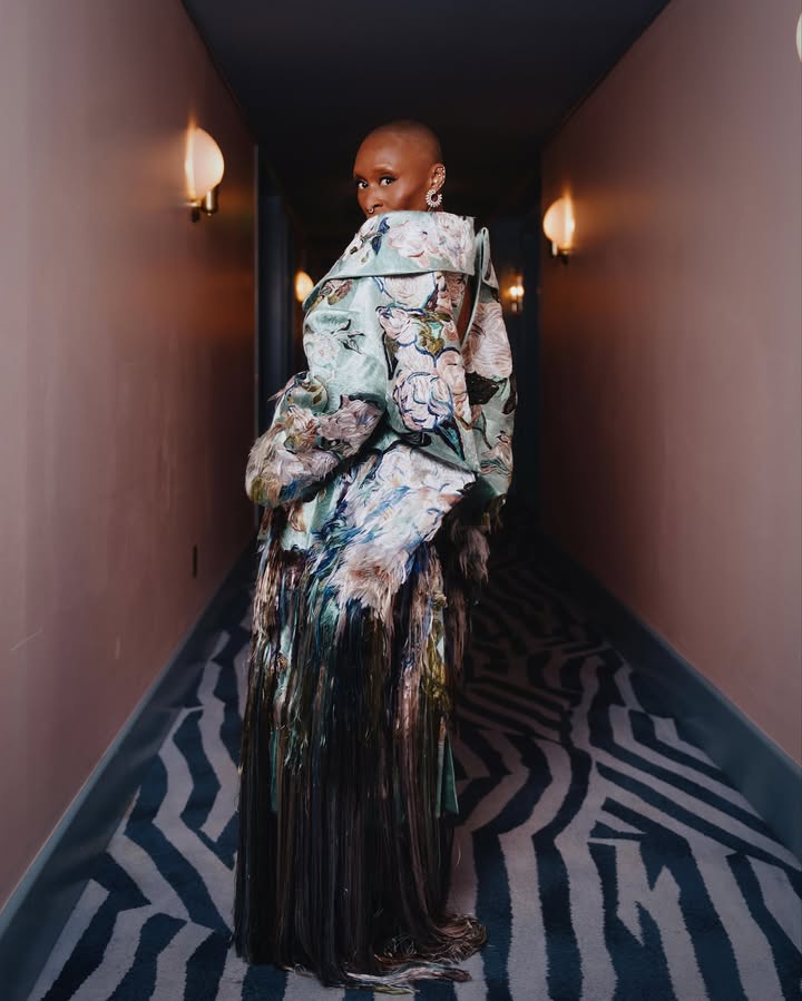 May be an image of one or more people, makeup, dress and text