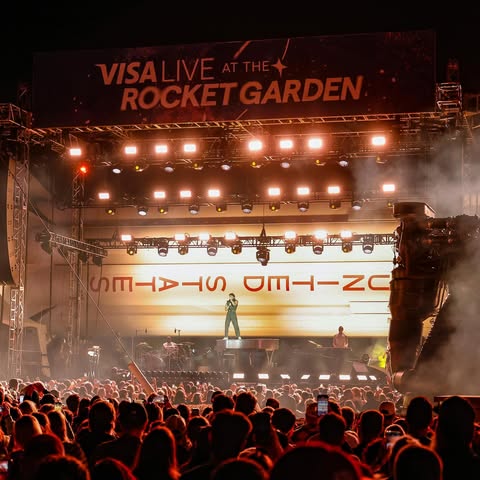 May be an image of crowd, concert and text that says 'VISALIVE IVE ATTHE+ VISA ROCKETGARDEN ROCKET GARDEN ብን 1ሎ፡ SD SINIS IA ഗா--ம OM--ZC'