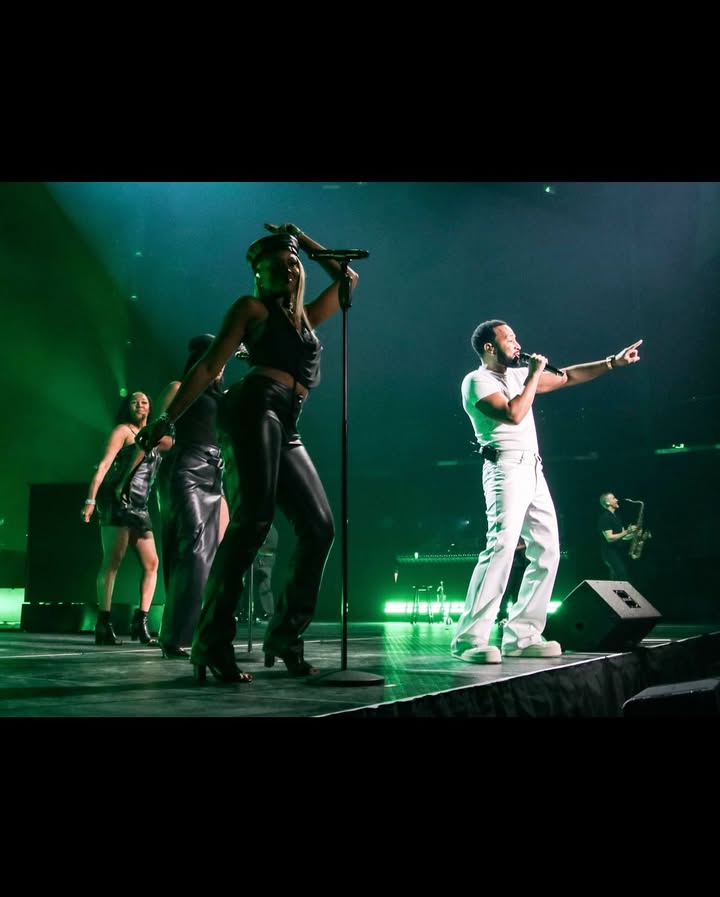 May be an image of dancing, microphone, concert and text