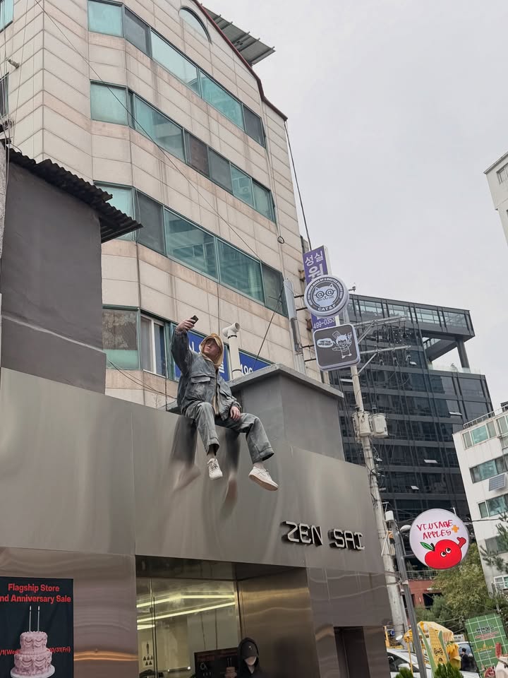 May be an image of signboard, skyscraper and buildings