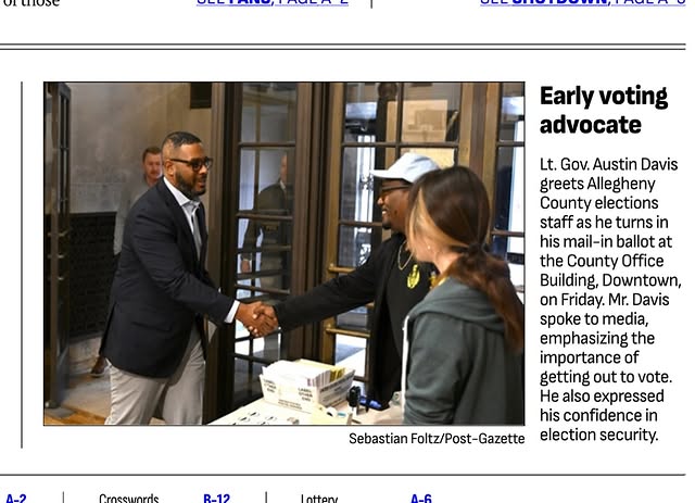 May be an image of standing, newspaper, magazine and poster