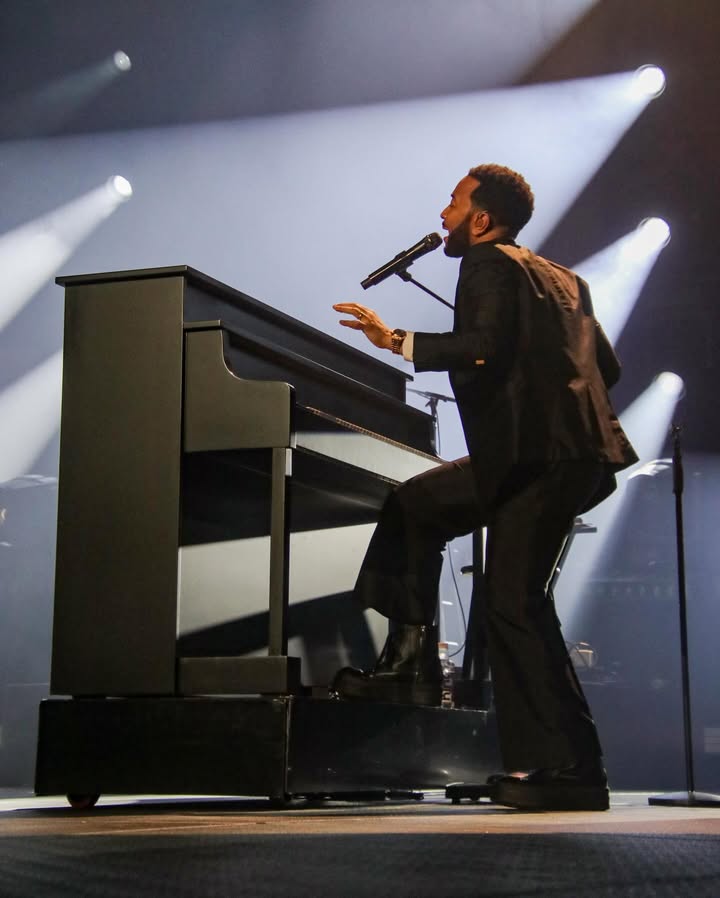 May be an image of piano, microphone, concert and text