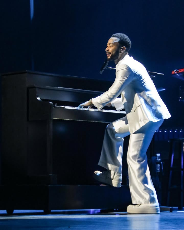 May be an image of piano, microphone, concert and text