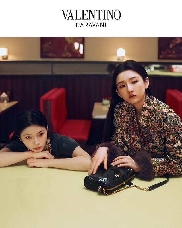 May be an image of one or more people, makeup, hair and text that says 'VALENTINO VAI GARAVANI'