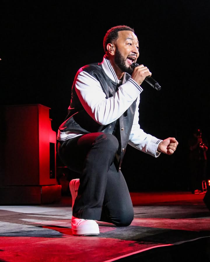 May be an image of microphone and concert