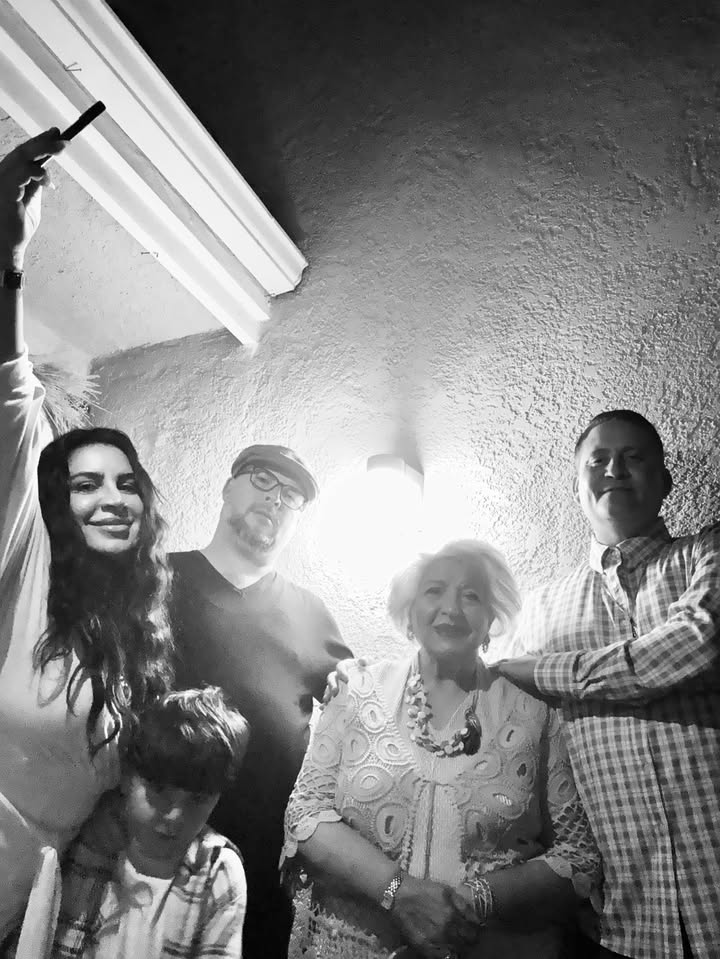 May be a black-and-white image of one or more people, people smiling and text