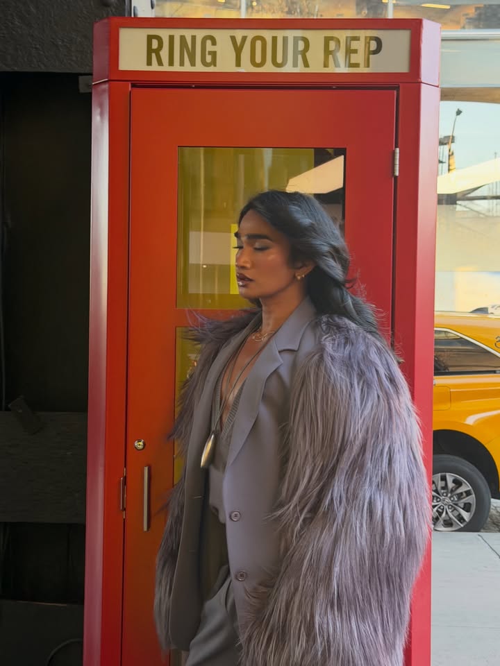 May be an image of one or more people, makeup, phone, overcoat, fur coat, telephone, cash machine and text that says 'RINGYOURREP YOUR REP RING'