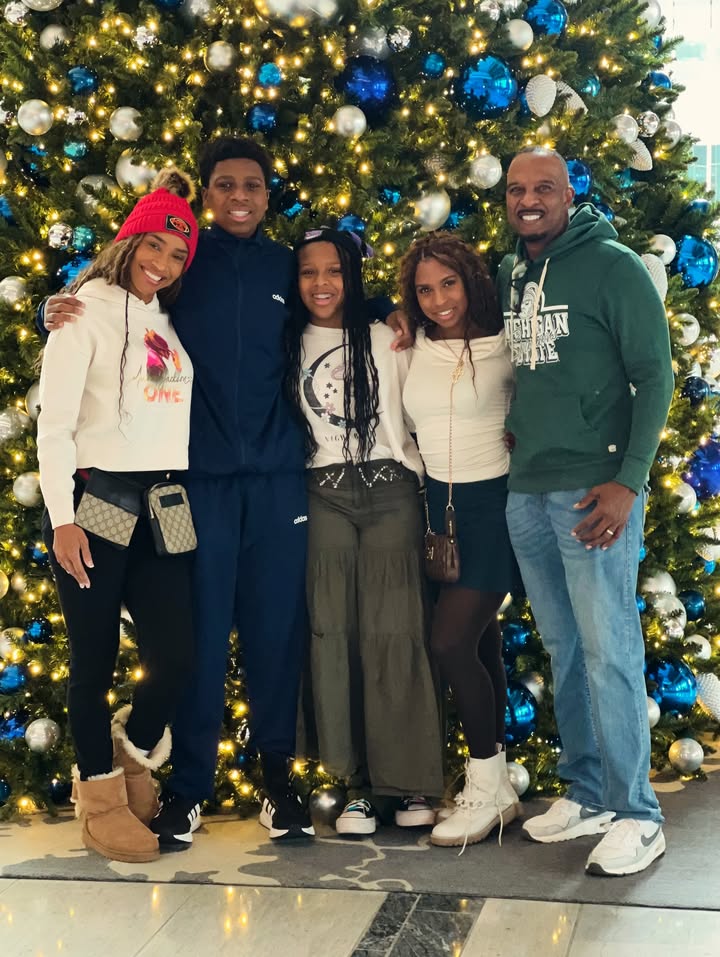 May be an image of standing, christmas tree and text