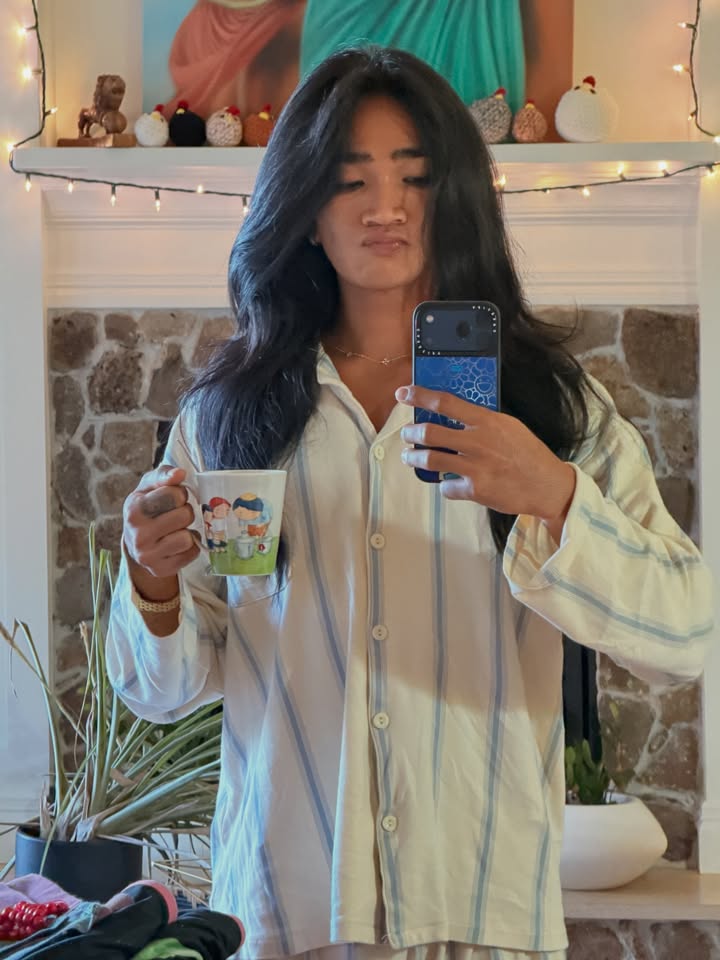 May be a selfie of sleepwear, bath robe, robe, tea and text