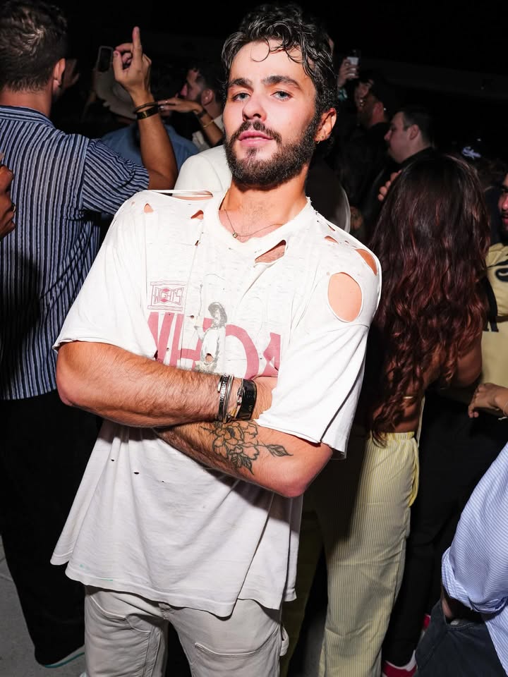 May be an image of one or more people, beard, top and text